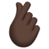 🫰🏿 hand with index finger and thumb crossed: dark skin tone display on Apple